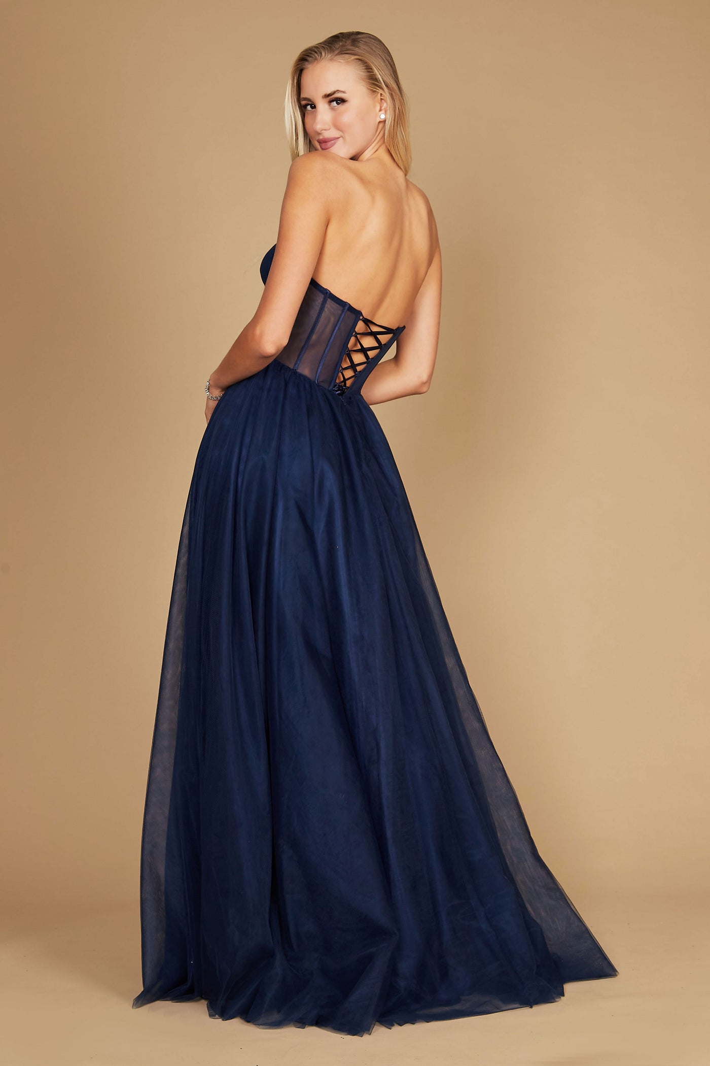 A stunning navy corset prom party dress featuring intricate detailing, designed for formal occasions, with a flowing ball gown silhouette that exudes elegance and sophistication.