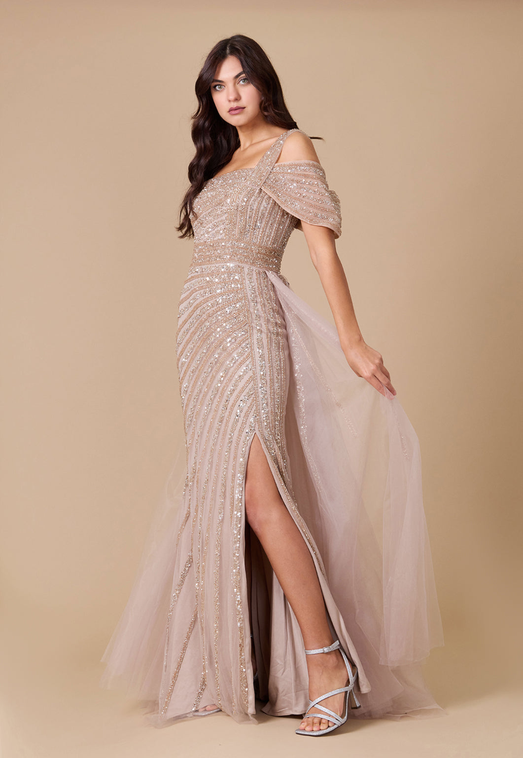 A stunning one-shoulder formal couture dress adorned with intricate hand-beaded details, showcasing elegance and sophistication.