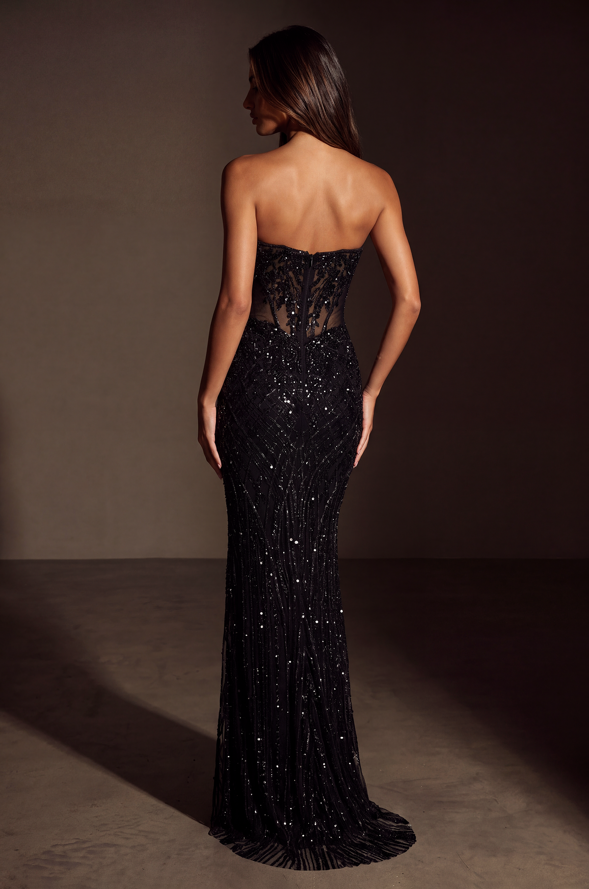Black strapless sequin formal gown, back view