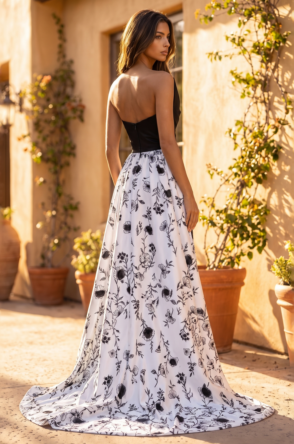 Back view of the formal gown showing the floral-print skirt and train