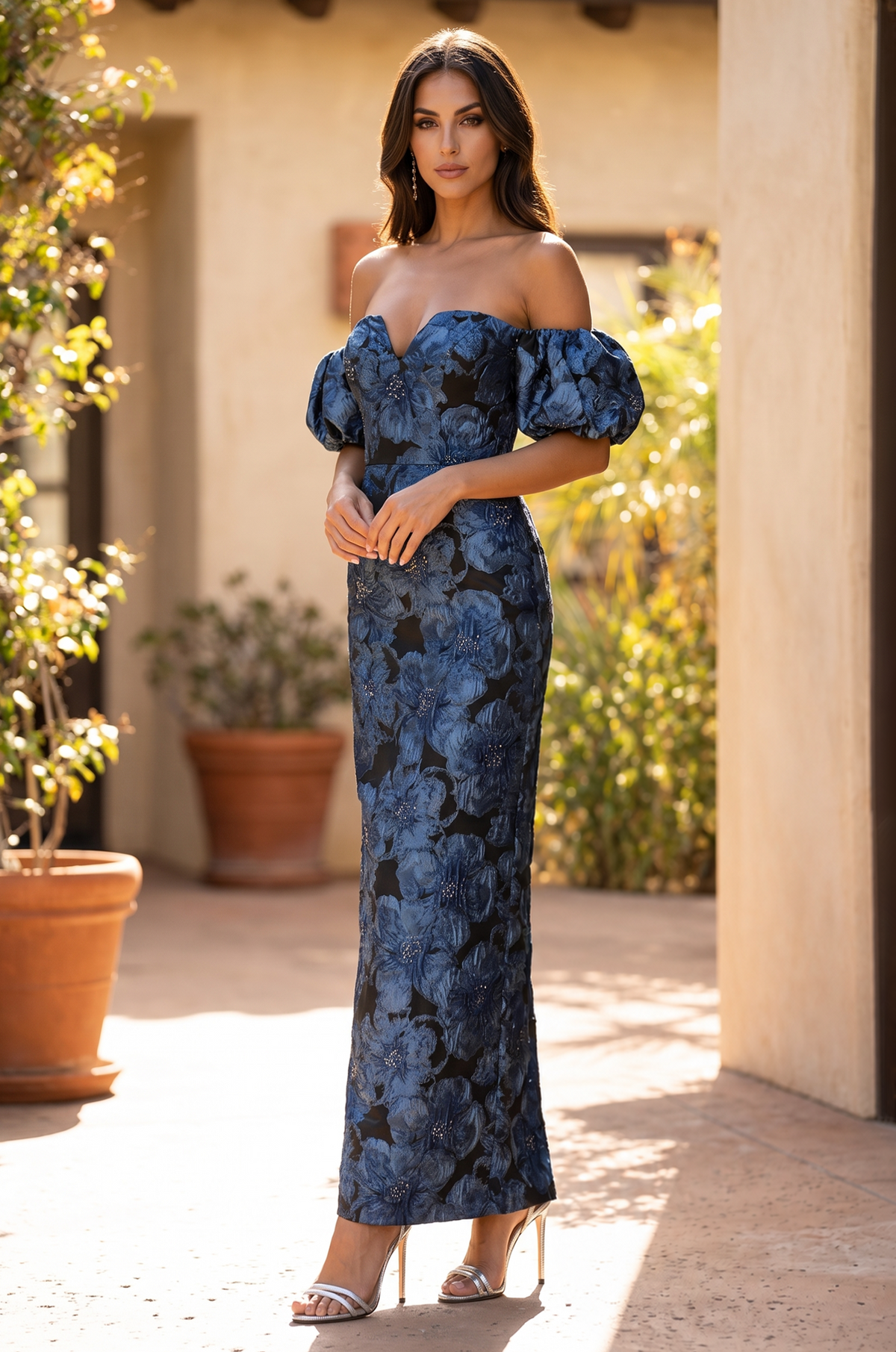 Full-length front view of the blue floral jacquard gown worn by a model.