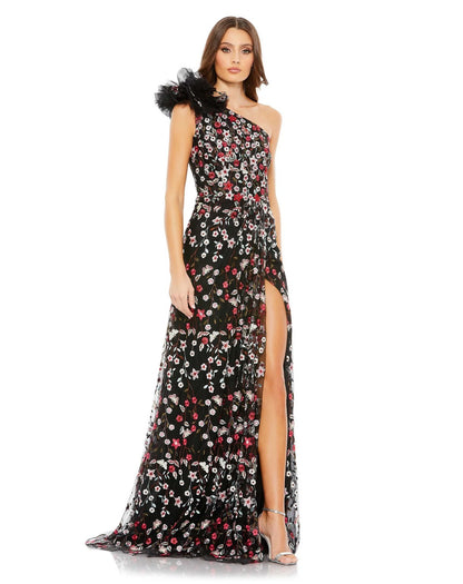 A woman in a black Mac Duggal 20331 Long One Shoulder Floral Dress with a slit.