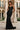 Elegant black sequin mermaid gown with spaghetti straps and a fitted silhouette, perfect for evening or formal events.