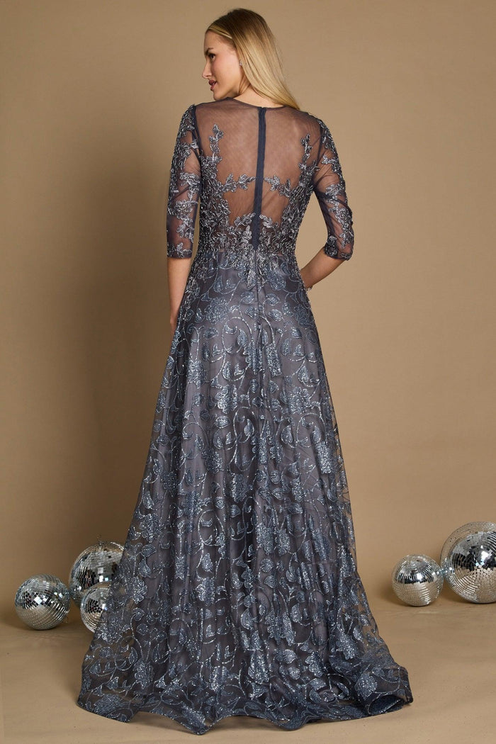 A long formal evening dress in charcoal gray, featuring intricate lace detailing and a flowing silhouette, elegantly draping to the floor.