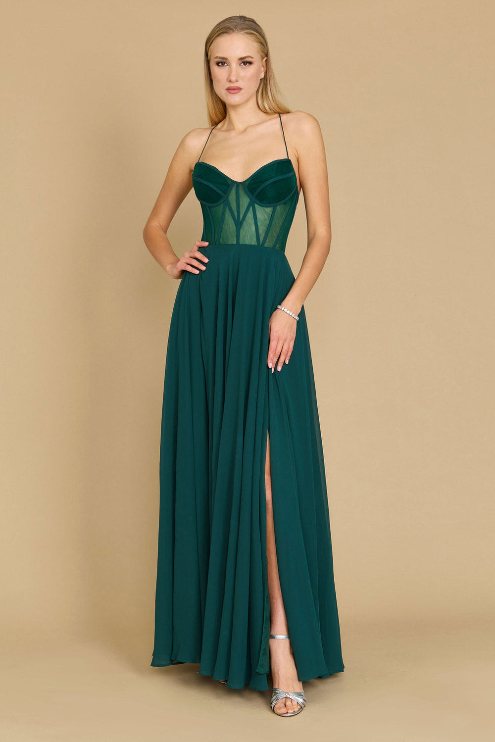 Elegant long chiffon corset formal prom dress in a rich emerald green, featuring a fitted bodice and flowing skirt, perfect for a glamorous evening event.