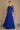 Elegant long sleeve mother of the bride dress in royal blue, adorned with intricate hand-beaded details, showcasing a sophisticated silhouette perfect for a wedding celebration.