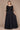 Elegant long sleeve black dress adorned with intricate hand-beaded details, designed for the mother of the bride, showcasing a sophisticated and timeless silhouette.