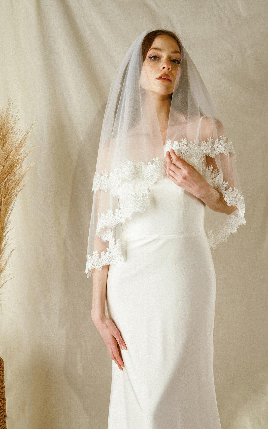 https://www.thedressoutlet.com/cdn/shop/products/short-waist-wedding-botanical-embroidery-bridal-veil-the-dress-outlet-4.jpg?v=1665837165&width=1080